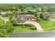 Aerial view of the house showcasing well-manicured landscaping and a circular driveway at 137 N Spring Lake Dr, Altamonte Springs, FL 32714