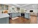 Modern kitchen with stainless steel appliances, stone countertops, and wood floors at 137 N Spring Lake Dr, Altamonte Springs, FL 32714