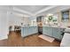 Eat-in kitchen with stone countertops, wood floors, stainless appliances, and modern lighting at 137 N Spring Lake Dr, Altamonte Springs, FL 32714