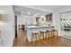Open-concept kitchen with seating for four at the island, stainless appliances, and eat-in dining at 137 N Spring Lake Dr, Altamonte Springs, FL 32714