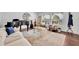 Cozy living room features comfortable seating and a beautiful piano; well-lit by natural light at 137 N Spring Lake Dr, Altamonte Springs, FL 32714