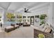 Bright sunroom with a pool view, ceiling fan and comfortable seating area at 137 N Spring Lake Dr, Altamonte Springs, FL 32714