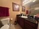 Bathroom with dark countertop, tile floor and large mirror over vanity at 1370 Tuscan Ter # 2202, Davenport, FL 33896