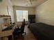 Bedroom featuring a ceiling fan, desk, and large window at 1370 Tuscan Ter # 2202, Davenport, FL 33896