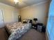 Bedroom featuring carpeted floors, a large window, and a comfortable bed at 1370 Tuscan Ter # 2202, Davenport, FL 33896