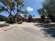 Exterior building with a light colored stone, palm trees, and beautiful Florida landscaping at 1370 Tuscan Ter # 2202, Davenport, FL 33896