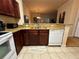 Well-lit kitchen with granite counters and stainless steel appliances at 1370 Tuscan Ter # 2202, Davenport, FL 33896