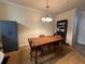 Well-lit living room featuring a chandelier and hardwood floors at 1370 Tuscan Ter # 2202, Davenport, FL 33896