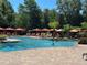 Large community pool with shade cabanas and lush greenery at 1370 Tuscan Ter # 2202, Davenport, FL 33896