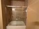 Tiled shower with glass door at 1370 Tuscan Ter # 2202, Davenport, FL 33896
