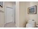 A functional bathroom featuring a toilet, shower, tile floors and neutral-toned walls at 14128 Bramble Bush Ct, Orlando, FL 32832
