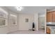 Bright dining area with two large windows and tile flooring at 14128 Bramble Bush Ct, Orlando, FL 32832