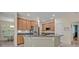 Kitchen featuring granite counters, wood cabinets, and stainless steel appliances at 14128 Bramble Bush Ct, Orlando, FL 32832