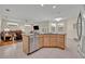 Open kitchen with granite counters, stainless appliances, and a view of the living area at 14128 Bramble Bush Ct, Orlando, FL 32832