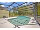 Screened-in pool with a clear blue water, surrounded by a spacious deck for lounging and outdoor enjoyment at 14128 Bramble Bush Ct, Orlando, FL 32832