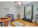 A functional room with wood floors, ample storage, and natural light from a window at 14128 Bramble Bush Ct, Orlando, FL 32832