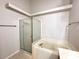 Bathroom showcasing shower stall over soaking tub at 14700 Chadbury Ct, Orlando, FL 32828
