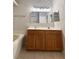 Bathroom boasts a double vanity, large mirrors, and a neutral color palette for a serene atmosphere at 14700 Chadbury Ct, Orlando, FL 32828