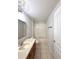 Bathroom with a vanity, toilet, tub and shower combo, and tiled flooring at 14700 Chadbury Ct, Orlando, FL 32828