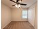 Bedroom with carpet, a ceiling fan, window, and a closet creating a functional space at 14700 Chadbury Ct, Orlando, FL 32828