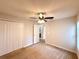 Bedroom features a closet, carpet, and entry to another room via doorway at 14700 Chadbury Ct, Orlando, FL 32828