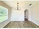 Dining room with stylish light fixture and new flooring at 14700 Chadbury Ct, Orlando, FL 32828