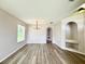 Spacious dining room features modern chandelier and new flooring at 14700 Chadbury Ct, Orlando, FL 32828