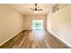 Bright, open living room featuring wood floors and sliding glass doors to the pool at 14700 Chadbury Ct, Orlando, FL 32828
