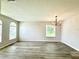 Bright and spacious living room featuring hardwood floors and abundant natural light at 14700 Chadbury Ct, Orlando, FL 32828