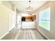 Open floor plan showing living room with kitchen and entryway at 14700 Chadbury Ct, Orlando, FL 32828