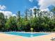 Large community swimming pool featuring a splash fountain for  at 14700 Chadbury Ct, Orlando, FL 32828
