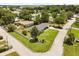 Aerial view of the property showcasing the fenced yard, landscaping, and neighborhood at 1505 N Lake Mirror Nw Dr, Winter Haven, FL 33881