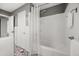 Bright bathroom featuring a shower and tub combination, decorative floor tile, and ample space at 1505 N Lake Mirror Nw Dr, Winter Haven, FL 33881