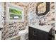 Stylish powder room with designer wallpaper, modern vanity, and natural light at 1505 N Lake Mirror Nw Dr, Winter Haven, FL 33881