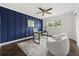 Chic home office with accent wall, a modern desk, and comfortable seating for work or study at 1505 N Lake Mirror Nw Dr, Winter Haven, FL 33881