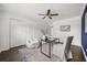 Bright home office featuring modern furnishings, including comfortable chairs and a dark wood floor at 1505 N Lake Mirror Nw Dr, Winter Haven, FL 33881