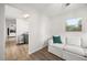 Cozy space off laundry room featuring vinyl floors, white walls and furniture at 1505 N Lake Mirror Nw Dr, Winter Haven, FL 33881