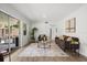 Cozy living room featuring a sliding glass door, neutral furniture, and stylish decor at 1505 N Lake Mirror Nw Dr, Winter Haven, FL 33881