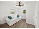 Bright living room with recessed lighting, hardwood floor, and a door to the outside at 1505 N Lake Mirror Nw Dr, Winter Haven, FL 33881