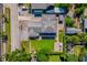 Aerial view showcases the property with its lush backyard, patio area, and proximity to the street at 1609 E Kaley Ave, Orlando, FL 32806