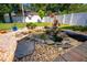 Serene backyard with landscaped water feature creating a peaceful outdoor oasis at 1609 E Kaley Ave, Orlando, FL 32806