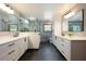Modern bathroom features double vanities, sleek fixtures, a walk-in shower, and stylish tile flooring at 1609 E Kaley Ave, Orlando, FL 32806