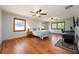 Spacious bedroom with hardwood floors, natural light, and ceiling fans provides a comfortable retreat at 1609 E Kaley Ave, Orlando, FL 32806