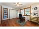Comfortable bedroom with decorative wallpaper, ceiling fan, and vintage furniture at 1609 E Kaley Ave, Orlando, FL 32806