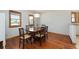 Charming dining room features hardwood floors, natural light, and a classic wooden table with seating for six at 1609 E Kaley Ave, Orlando, FL 32806