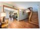 Beautiful foyer with hardwood floors, staircase, and an open view to the kitchen area at 1609 E Kaley Ave, Orlando, FL 32806