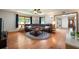 Cozy living room with wood floors, a comfortable sectional sofa, and natural light at 1609 E Kaley Ave, Orlando, FL 32806