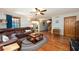 Spacious living room featuring hardwood floors, a comfortable sofa, and an open layout at 1609 E Kaley Ave, Orlando, FL 32806