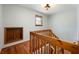 Charming wooden stairway with natural light streaming from an upstairs window at 1609 E Kaley Ave, Orlando, FL 32806