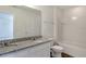 Bright bathroom featuring dual sinks, granite countertop, tub, and toilet at 16242 Outlook Shore Aly, Winter Garden, FL 34787
